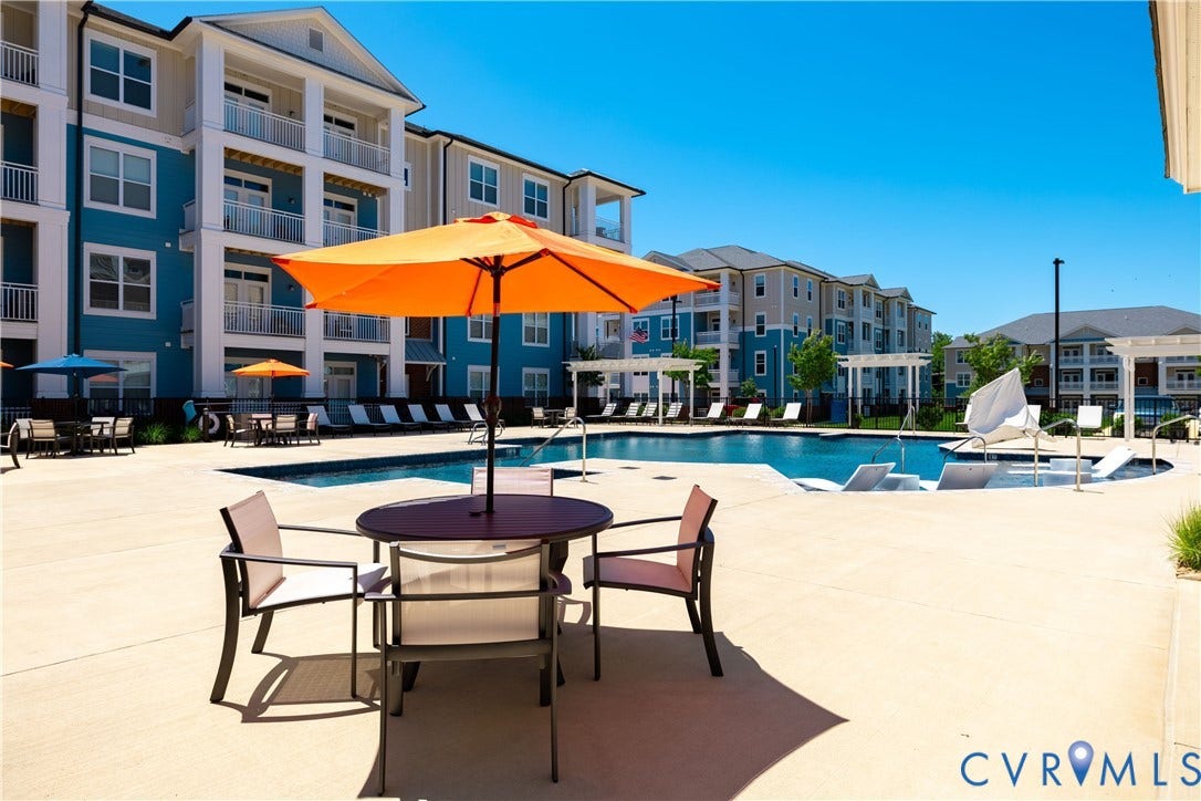 Expansive outdoor swimming pool with integrated tanning ledges