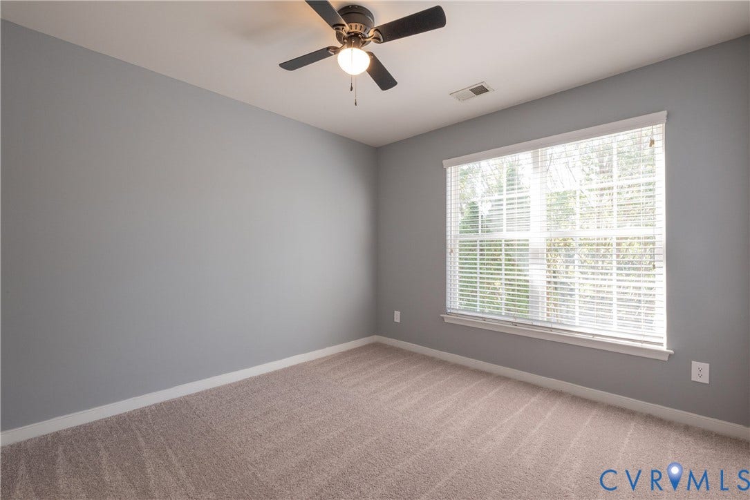 Bedroom #3 Neutral wall color, window with blinds, ceiling fan with light fixture, and carpeted flooring
