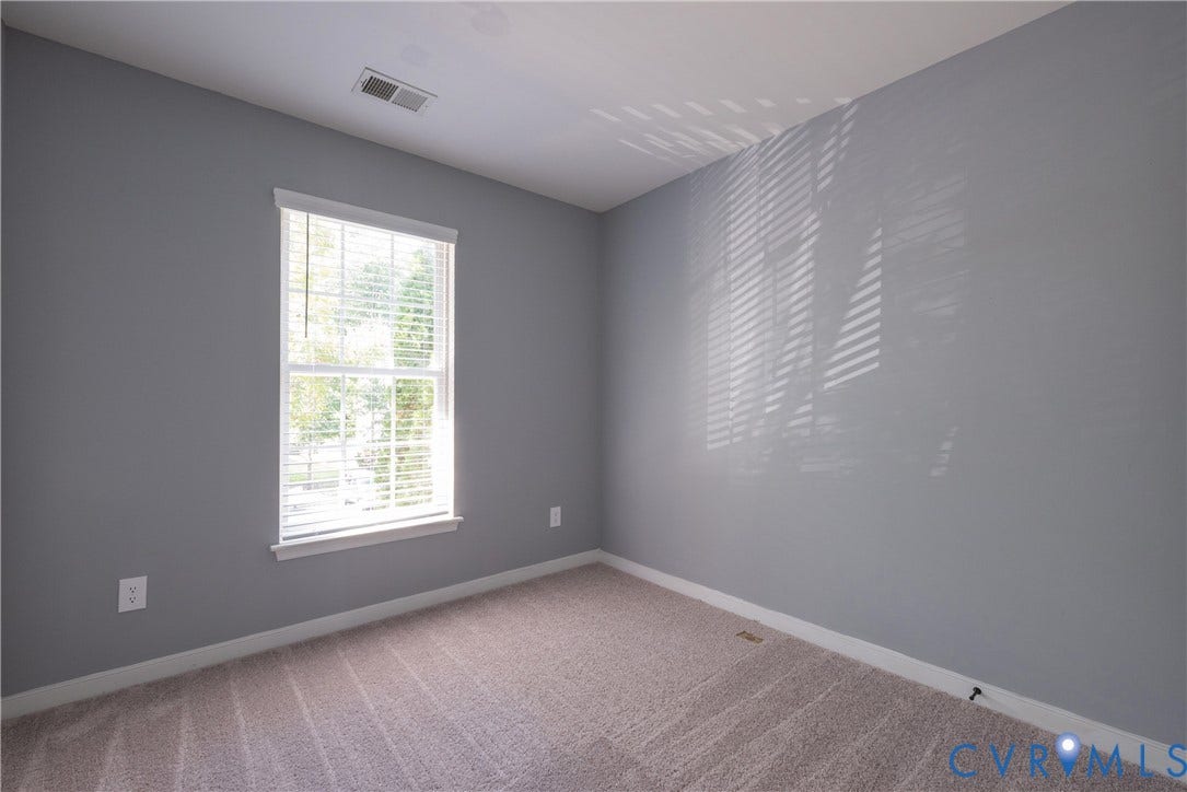 Bedroom #2 all-to-wall carpeting, single window with blinds, and light gray painted walls