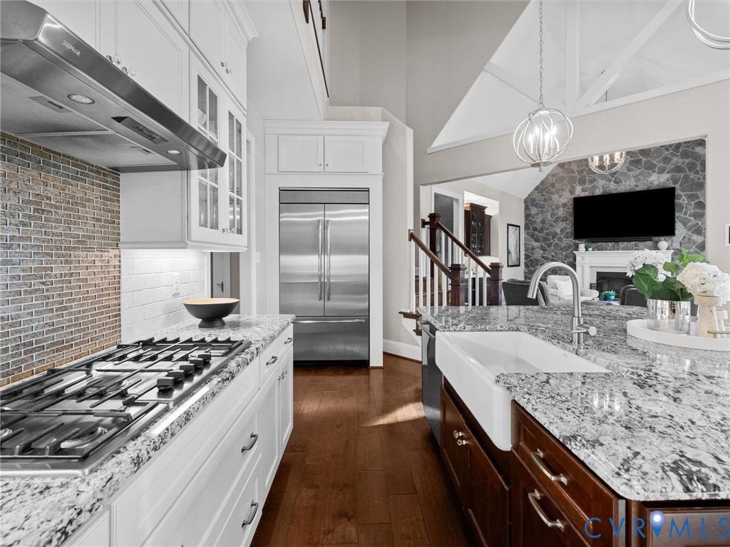 7750 Rock Cress Place, Chesterfield, VA 23120 Kitchen featuring white cabinetry, stone countertops, a farmhouse-style apron sink, a stainless steel gas cooktop with a range hood, and wood-finish flooring