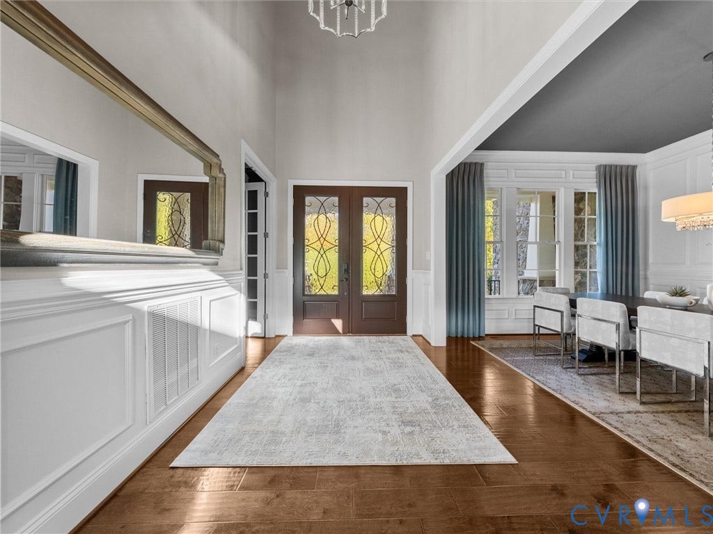7750 Rock Cress Place, Chesterfield, VA 23120 Double-entry doors with decorative glass insets, soaring ceilings, wood-finish flooring, and crisp wall molding throughout