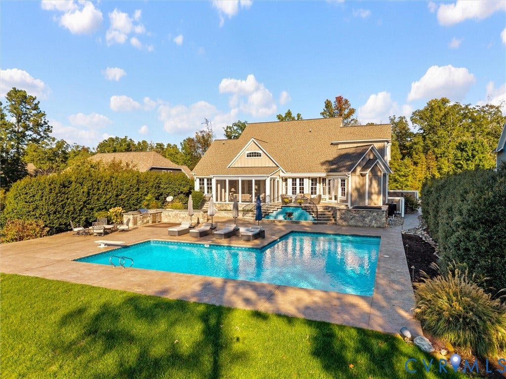 7750 Rock Cress Place, Chesterfield, VA 23120 In-ground swimming pool with stamped concrete decking, stone-faced retaining walls, built-in outdoor kitchen, and screened porch