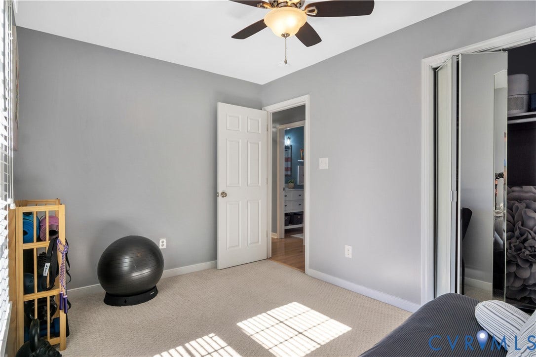 2724 Glen Point Circle, Henrico, VA 23233 Spacious secondary bedroom with neutral gray walls, ceiling fan with brass fixture, and neutral carpet flooring
