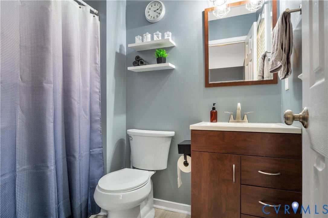 2724 Glen Point Circle, Henrico, VA 23233 Bathroom featuring a single vanity with wood-finish cabinetry, white countertop, and a recessed sink