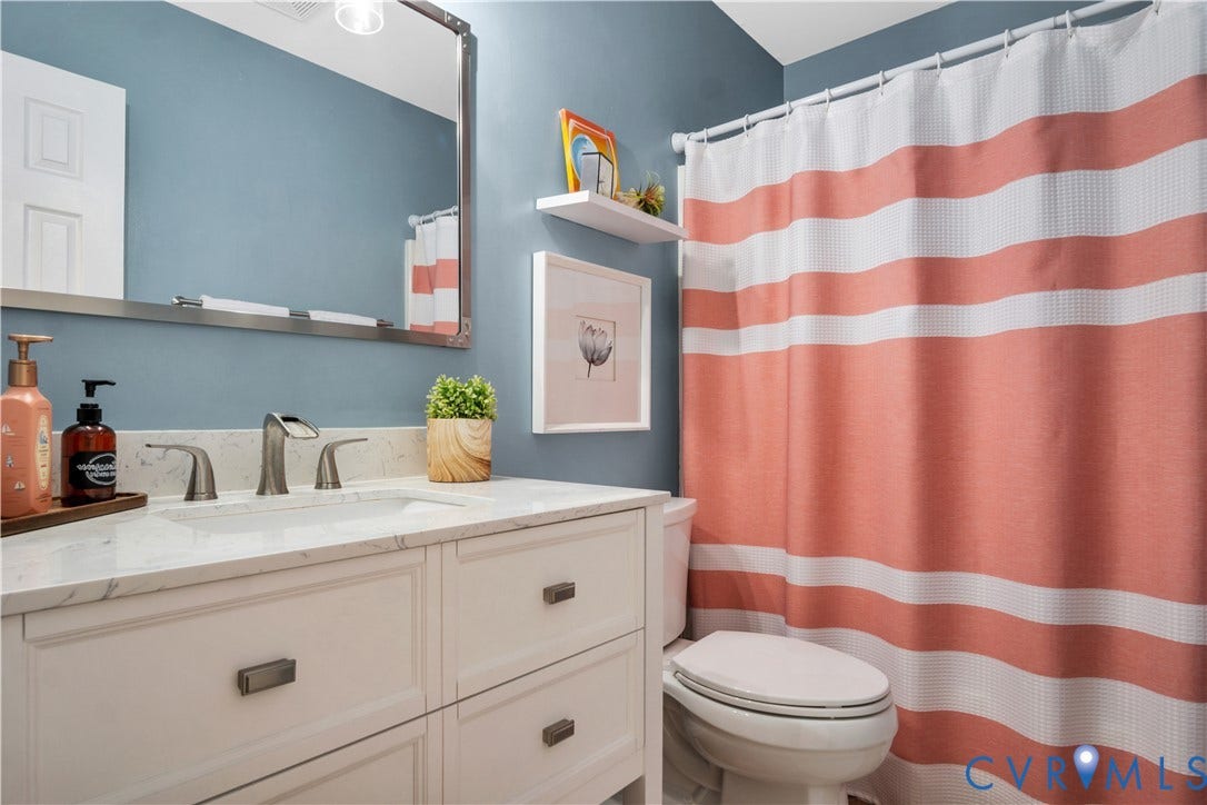2724 Glen Point Circle, Henrico, VA 23233 White vanity with recessed panel doors and drawers, undermount sink, countertop, and brushed nickel faucet