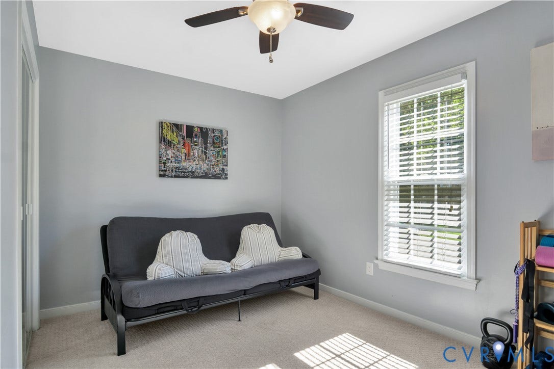 2724 Glen Point Circle, Henrico, VA 23233 Wall-mounted ceiling fan with integrated lighting, a single window with blinds, and carpeted flooring