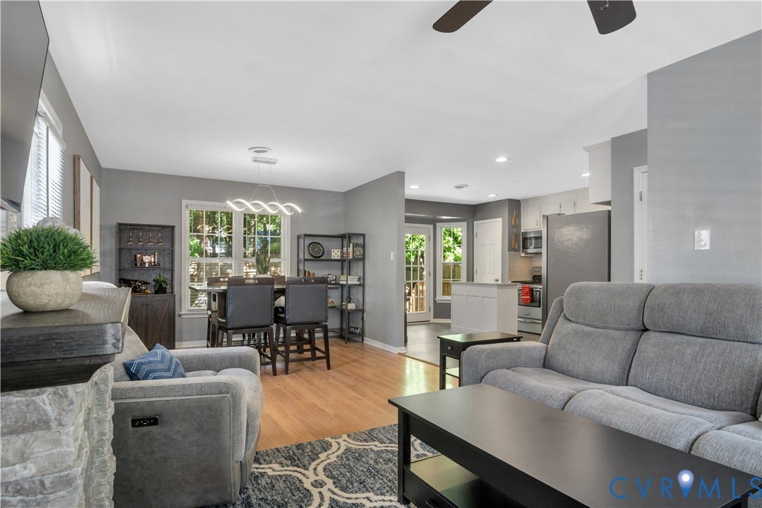2724 Glen Point Circle, Henrico, VA 23233 Hardwood-style flooring throughout, modern dining room chandelier, recessed lighting in kitchen, double French doors, and stainless steel appliances