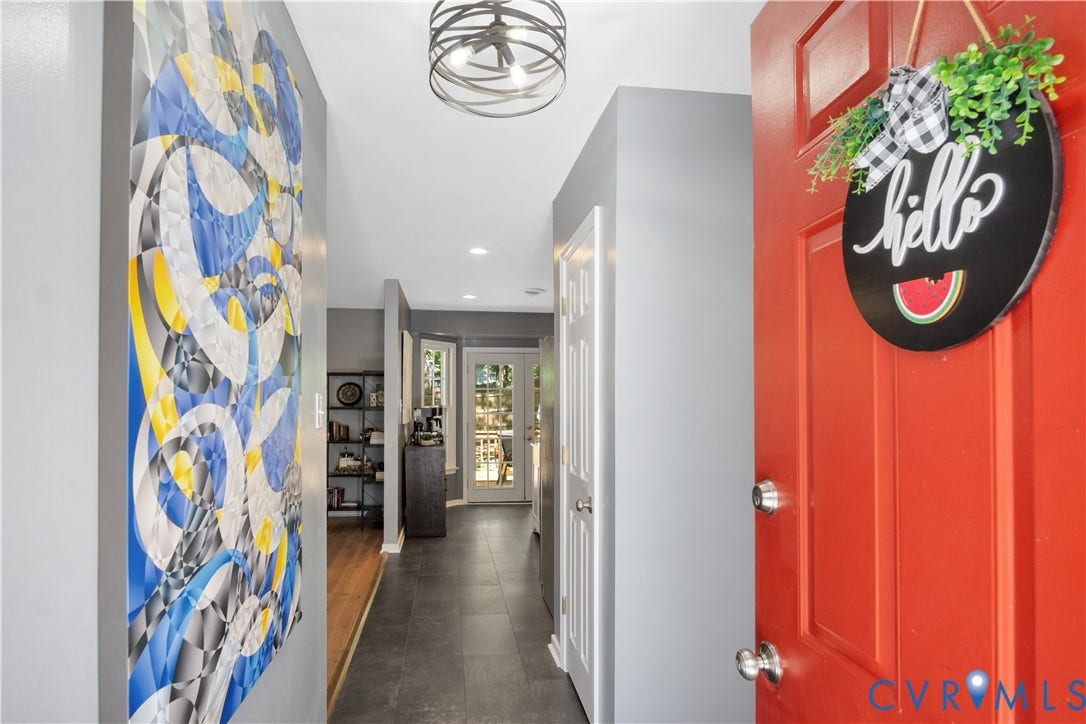 2724 Glen Point Circle, Henrico, VA 23233 Vibrant red entry door, contemporary overhead lighting fixture, and tile flooring extending into the hallway