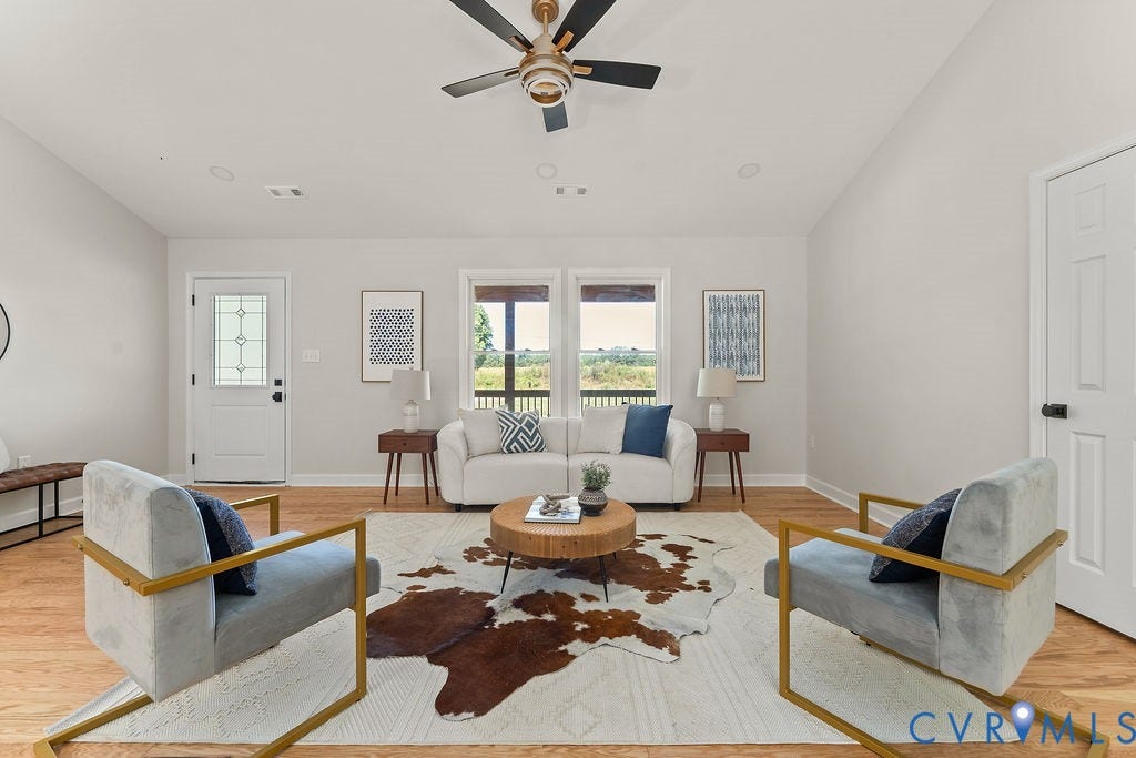 Vaulted ceiling with a ceiling fan, recessed lighting, wood-finish flooring, and white trim