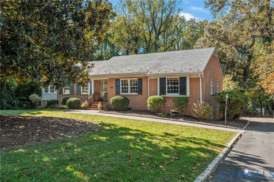 3700 Wakefield Road, Stratofrd Hills, Richmond, VA 23235 Brick exterior featuring gabled roof lines, multi-pane windows with operable shutters, and an asphalt driveway