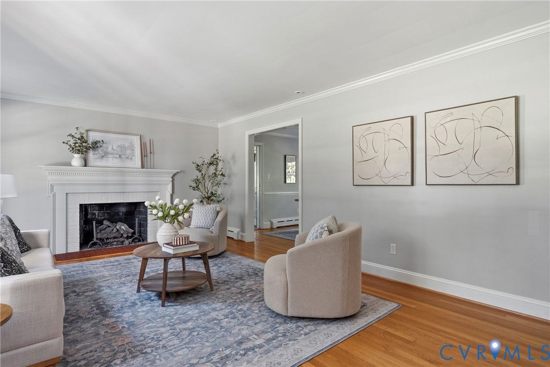 3700 Wakefield Road, Stratofrd Hills, Richmond, VA 23235 Living area featuring hardwood flooring, crown molding, and a white mantel fireplace with a tile surround