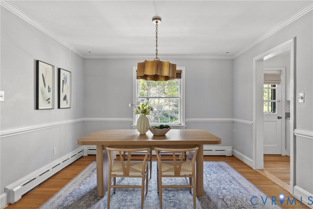 3700 Wakefield Road, Stratofrd Hills, Richmond, VA 23235 Dining area featuring decorative wall molding, hardwood flooring, and a multi-tiered metallic pendant light fixture