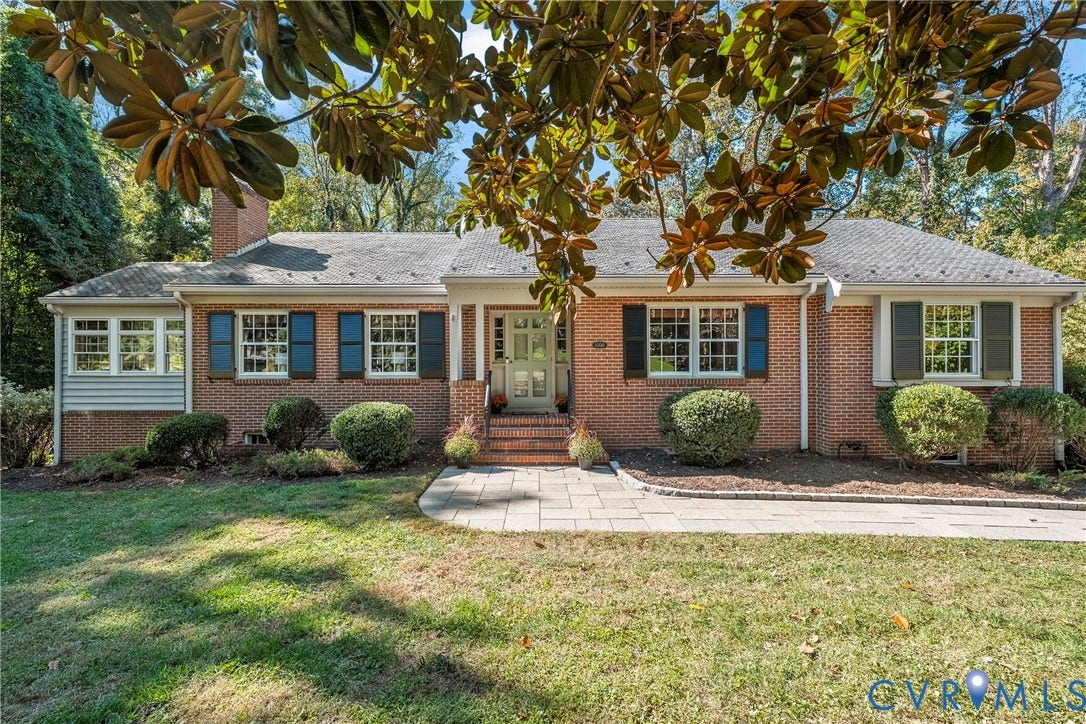 3700 Wakefield Road, Stratofrd Hills, Richmond, VA 23235 Single-story brick exterior featuring a stone-paved walkway, multi-pane windows with operable shutters, and a covered front entryway with brick steps