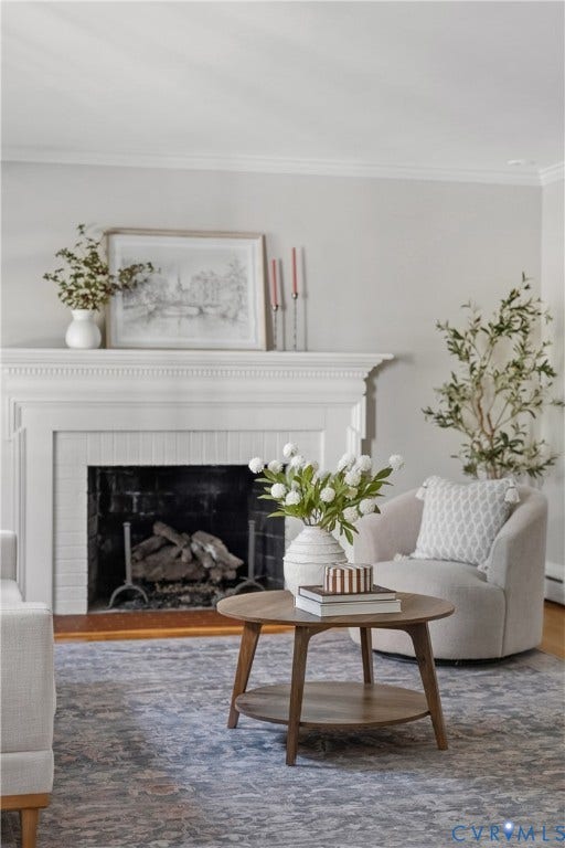 3700 Wakefield Road, Stratofrd Hills, Richmond, VA 23235 Fireplace featuring a white mantel, decorative trim, and wood-finish flooring