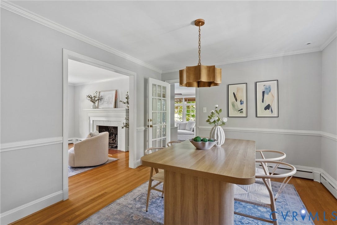3700 Wakefield Road, Stratofrd Hills, Richmond, VA 23235 Dining area featuring hardwood flooring, crown molding, chair rail trim, a multi-pane glass door, and a metallic tiered chandelier