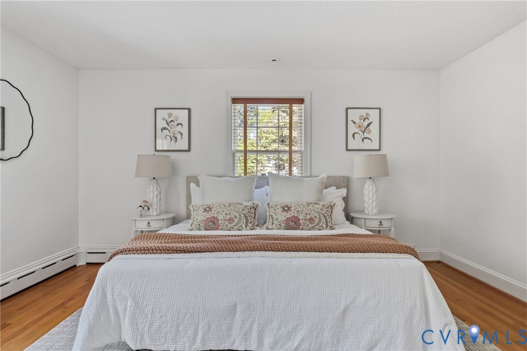 3700 Wakefield Road, Stratofrd Hills, Richmond, VA 23235 Neutral interior walls, wood-finish flooring, and single-pane window with wood-trim surround