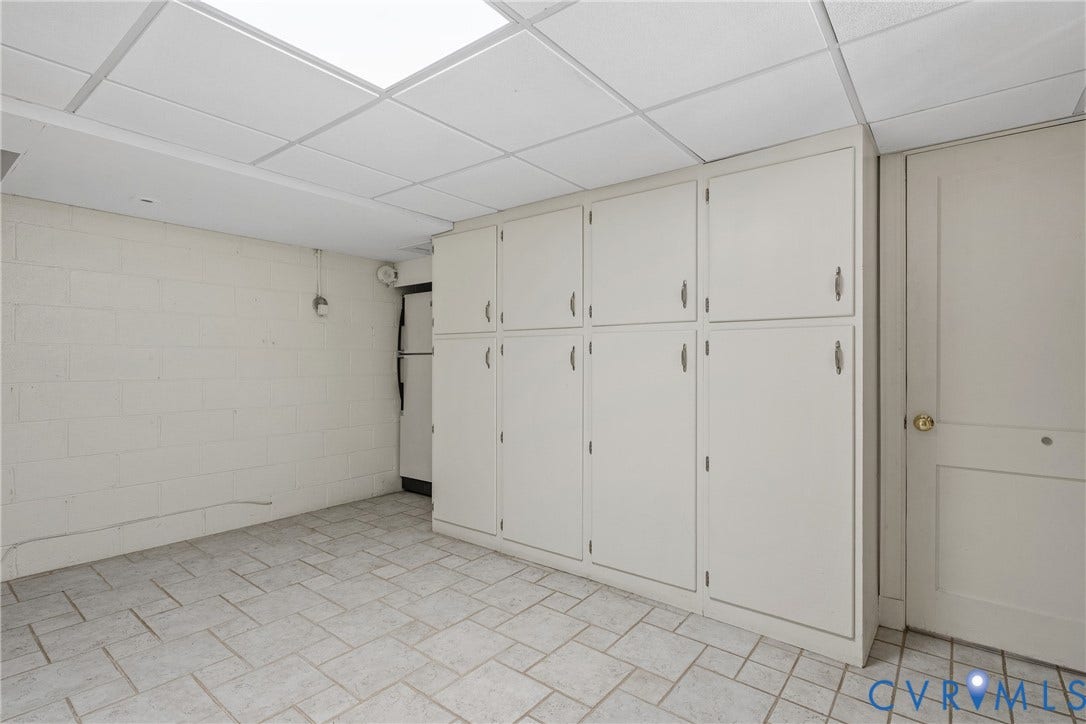 3700 Wakefield Road, Stratofrd Hills, Richmond, VA 23235 Built-in floor-to-ceiling cabinetry, tiled flooring, drop ceiling with recessed lighting, and painted masonry walls