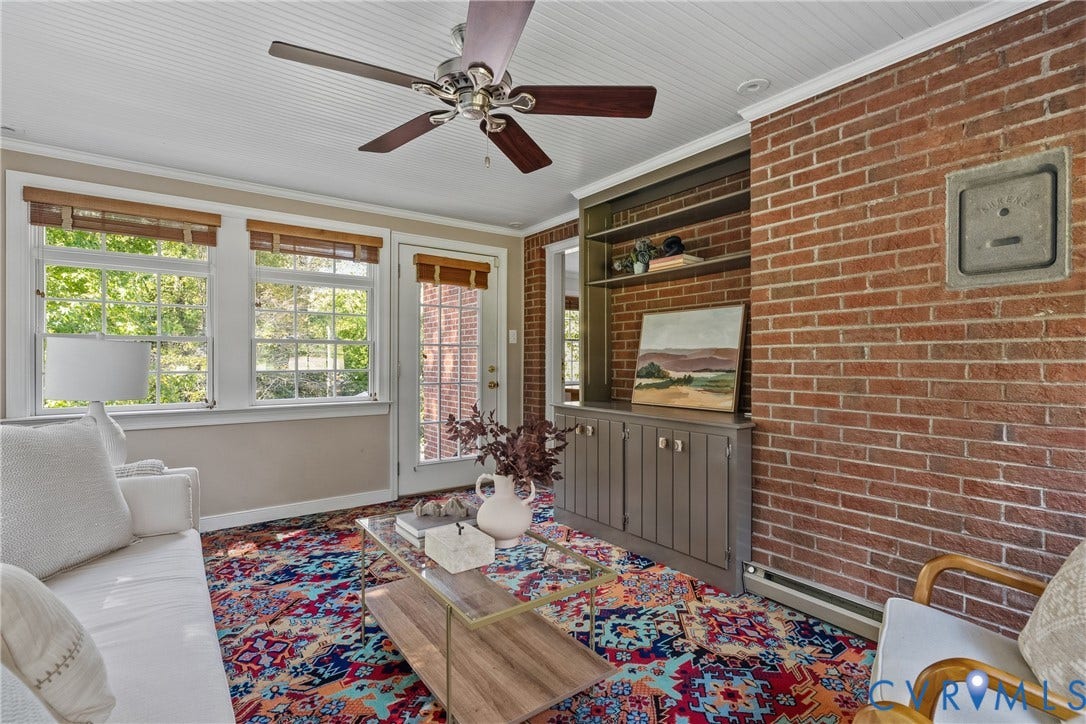 3700 Wakefield Road, Stratofrd Hills, Richmond, VA 23235 Exposed brick wall featuring built-in cabinetry with shelving, beadboard ceiling, ceiling fan, and multi-pane windows