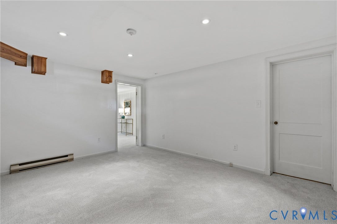 3700 Wakefield Road, Stratofrd Hills, Richmond, VA 23235 Neutral-toned carpeting, recessed ceiling lighting, two-panel interior door, and exposed wood structural accents