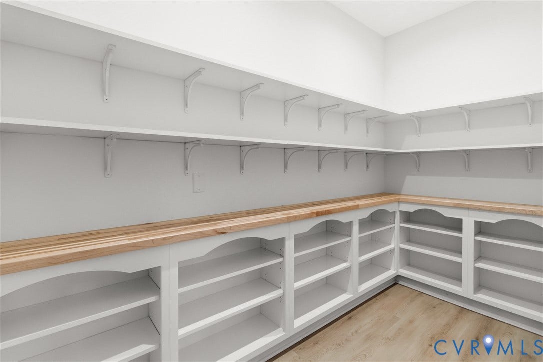 34356 Chinquapin Road, Waverly, VA 23890 Built-in shelving with wood-finish countertops and wood-finish flooring