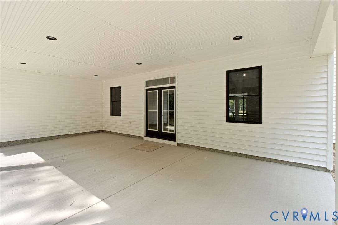 34356 Chinquapin Road, Waverly, VA 23890 Covered patio featuring a concrete surface, white siding, recessed lighting, and black-framed windows