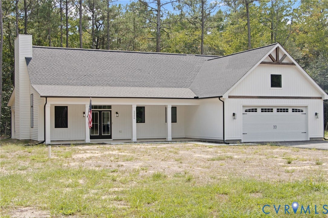 34356 Chinquapin Road, Waverly, VA 23890 White vertical siding exterior with black trim