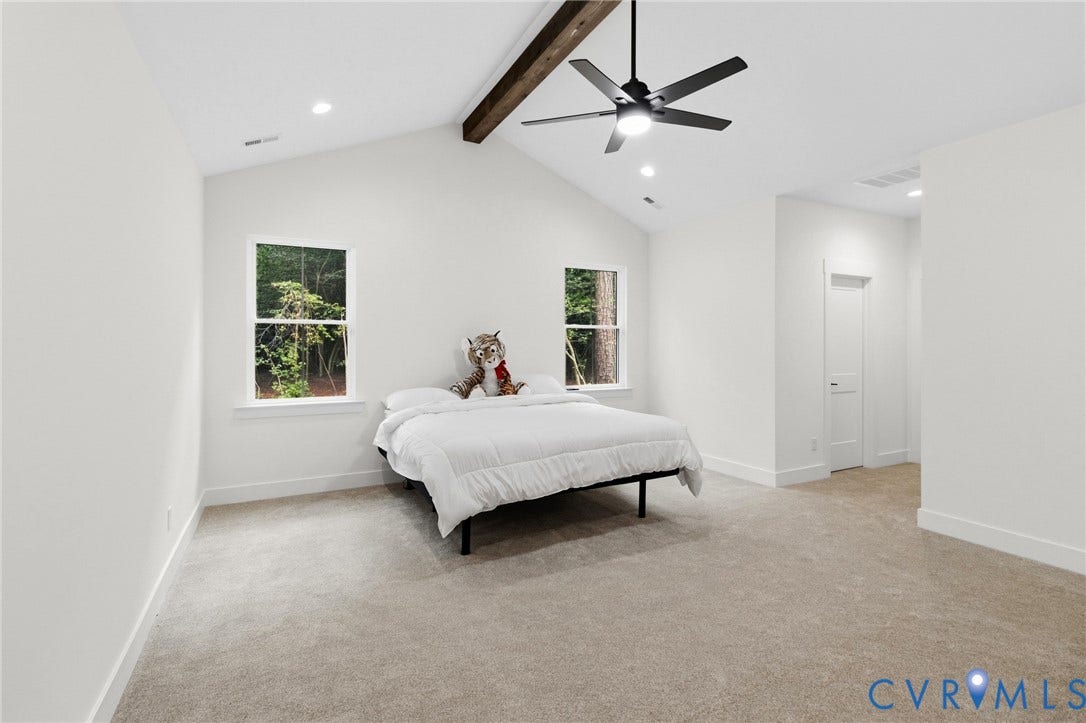 34356 Chinquapin Road, Waverly, VA 23890 Vaulted ceiling with an exposed wood beam, recessed lighting, and a ceiling fan