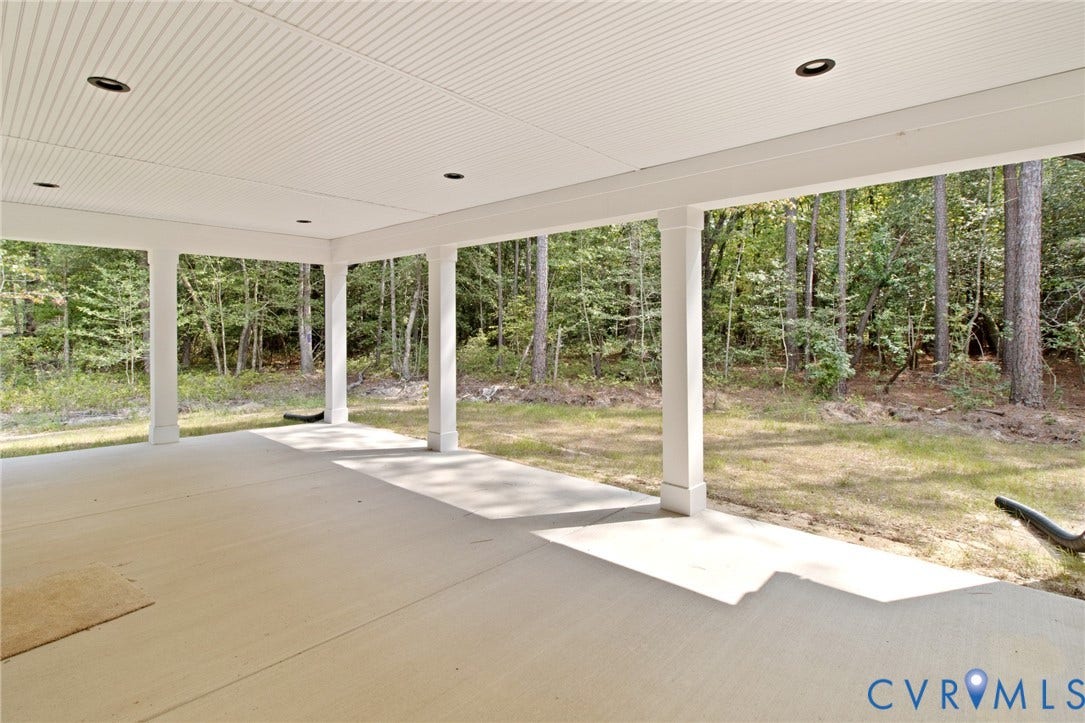 34356 Chinquapin Road, Waverly, VA 23890 Spacious covered patio with concrete flooring, recessed lighting, and a white beadboard ceiling