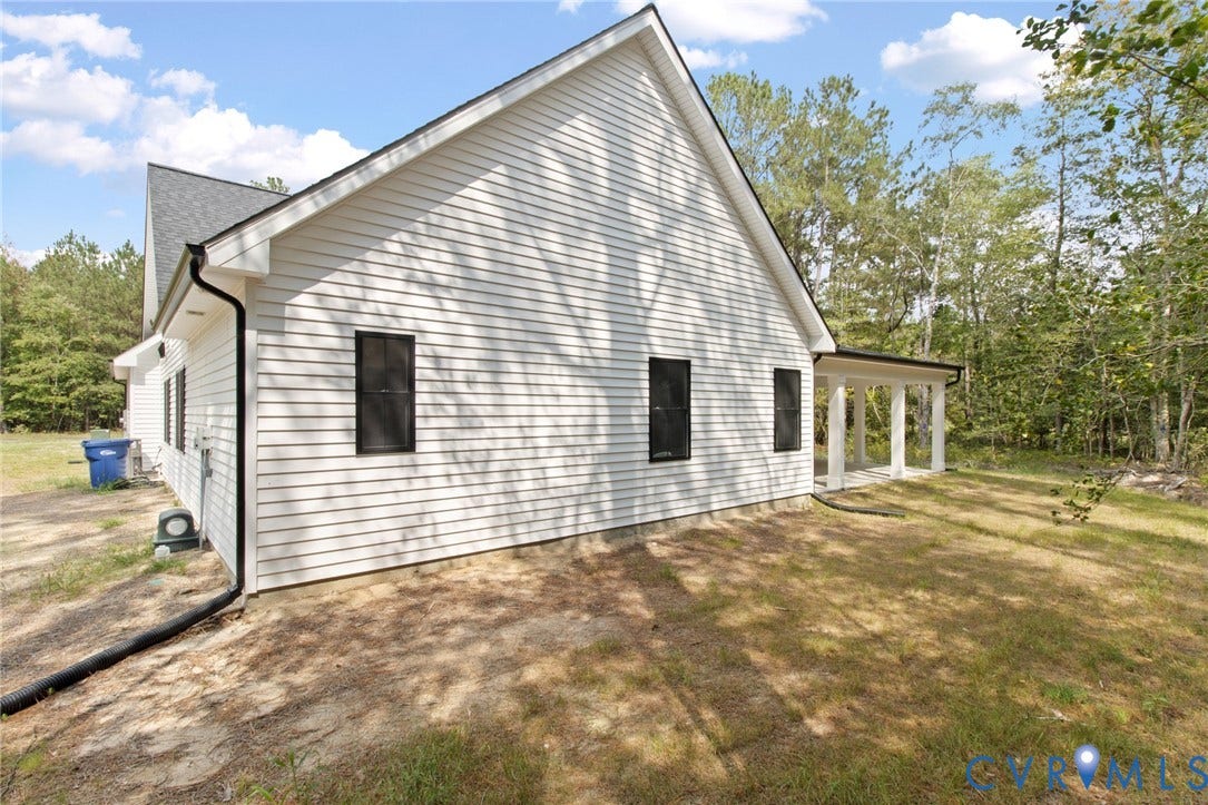 34356 Chinquapin Road, Waverly, VA 23890 White horizontal siding exterior with a black shingled roof