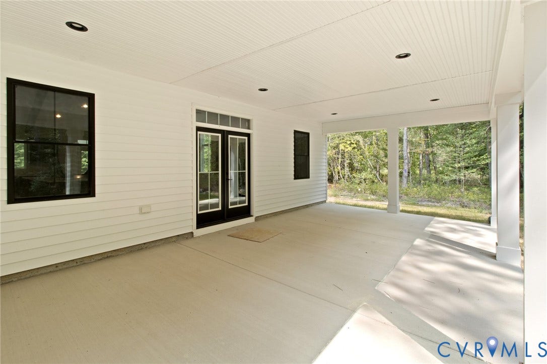 34356 Chinquapin Road, Waverly, VA 23890 Expansive covered patio with recessed lighting, beadboard ceiling, and white siding