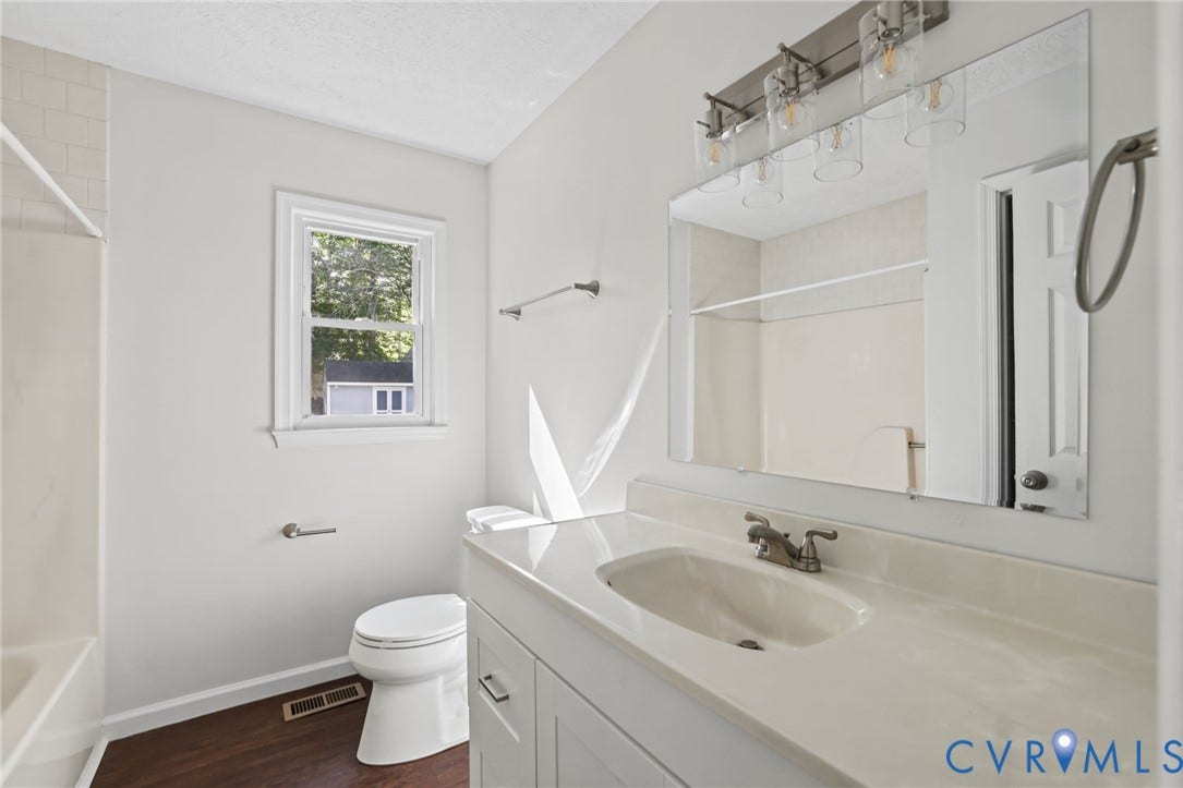 13811 Buck Rub Drive, Chesterfield, VA 23112 Vanity with integrated sink, white cabinetry, and brushed nickel hardware
