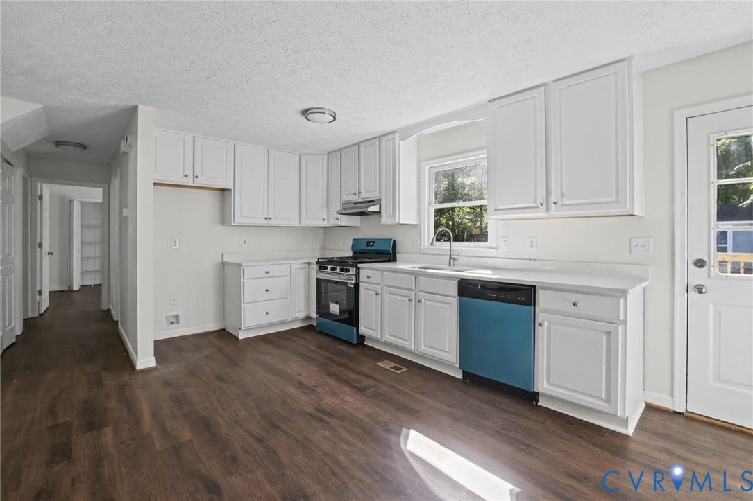 13811 Buck Rub Drive, Chesterfield, VA 23112 Kitchen featuring wood-finish flooring, white cabinetry, a built-in dishwasher, and a gas range