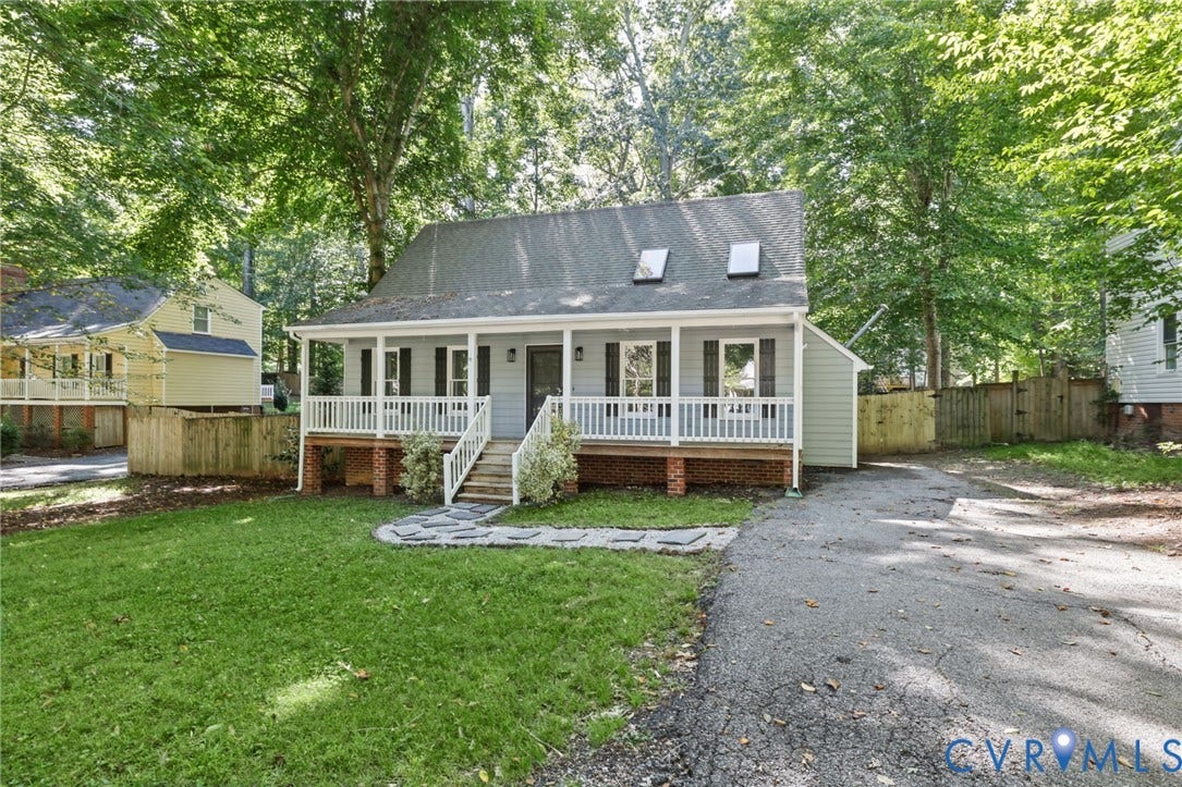 13811 Buck Rub Drive, Chesterfield, VA 23112 Light blue siding exterior with a covered front porch featuring white railings