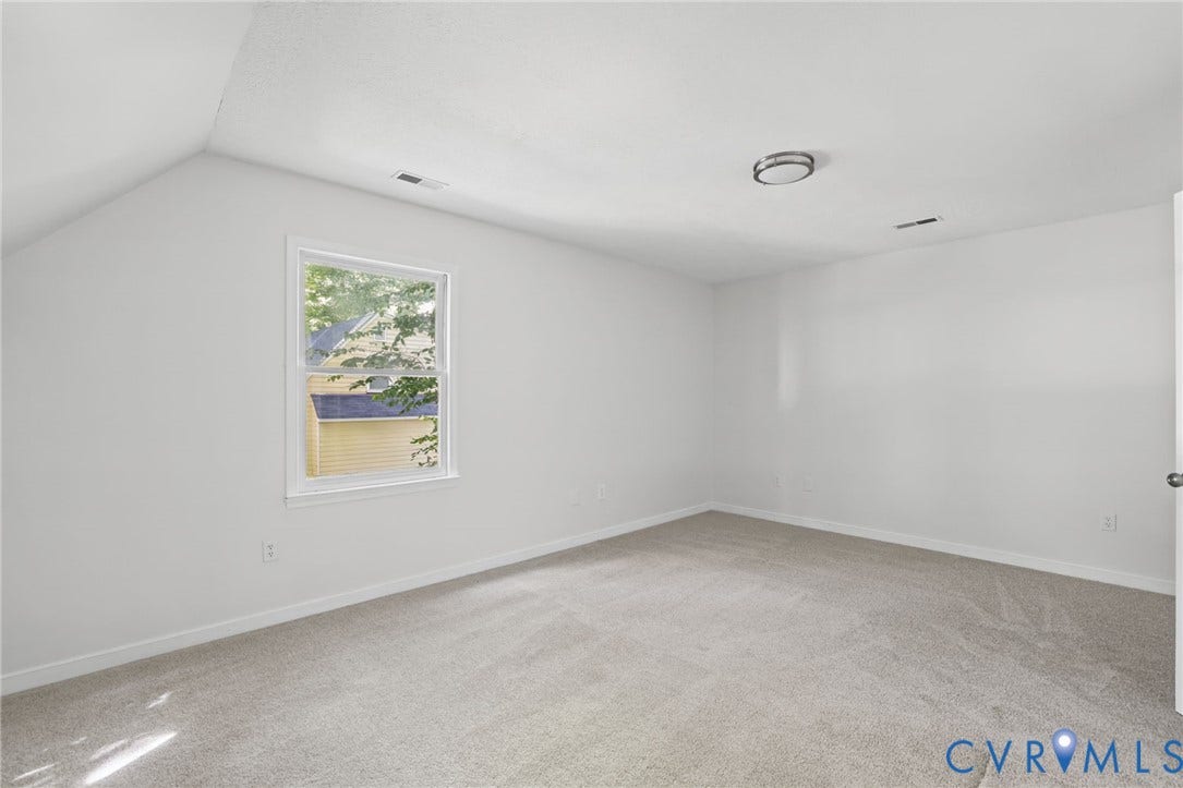 13811 Buck Rub Drive, Chesterfield, VA 23112 Neutral wall color, wall-to-wall carpeting, window with natural light, modern flush mount ceiling light, and a white interior door