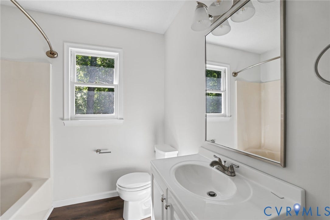 13811 Buck Rub Drive, Chesterfield, VA 23112 White vanity with integrated sink, chrome faucet, and rectangular mirror
