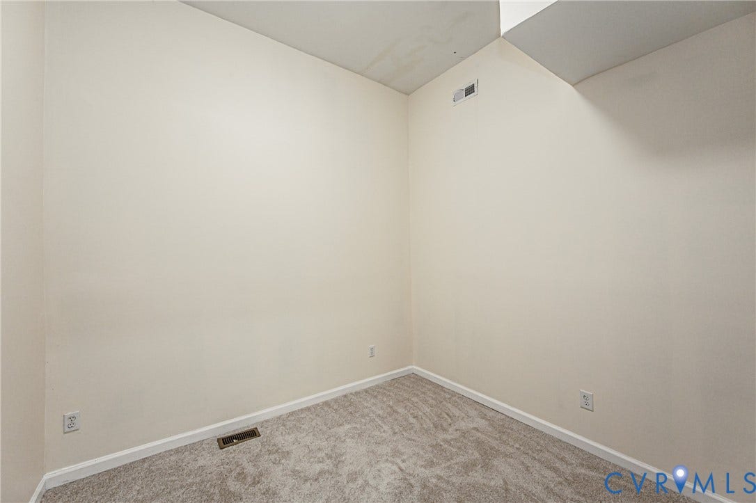 2011 Chicago Avenue, Richmond, VA 23224 Interior space featuring neutral-toned carpeting and light-colored walls