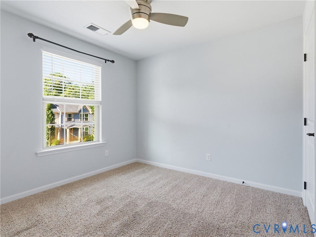5612 Riverside Heights Way, Richmond, VA 23225 Carpeted bedroom offers flexible space for overnight guests, hobbies, or a dedicated work area.