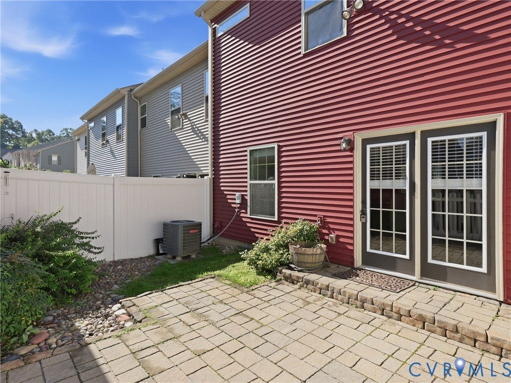 5612 Riverside Heights Way, Richmond, VA 23225 Brick rear patio and fully fenced backyard provide space for outdoor dining, relaxing, and entertaining