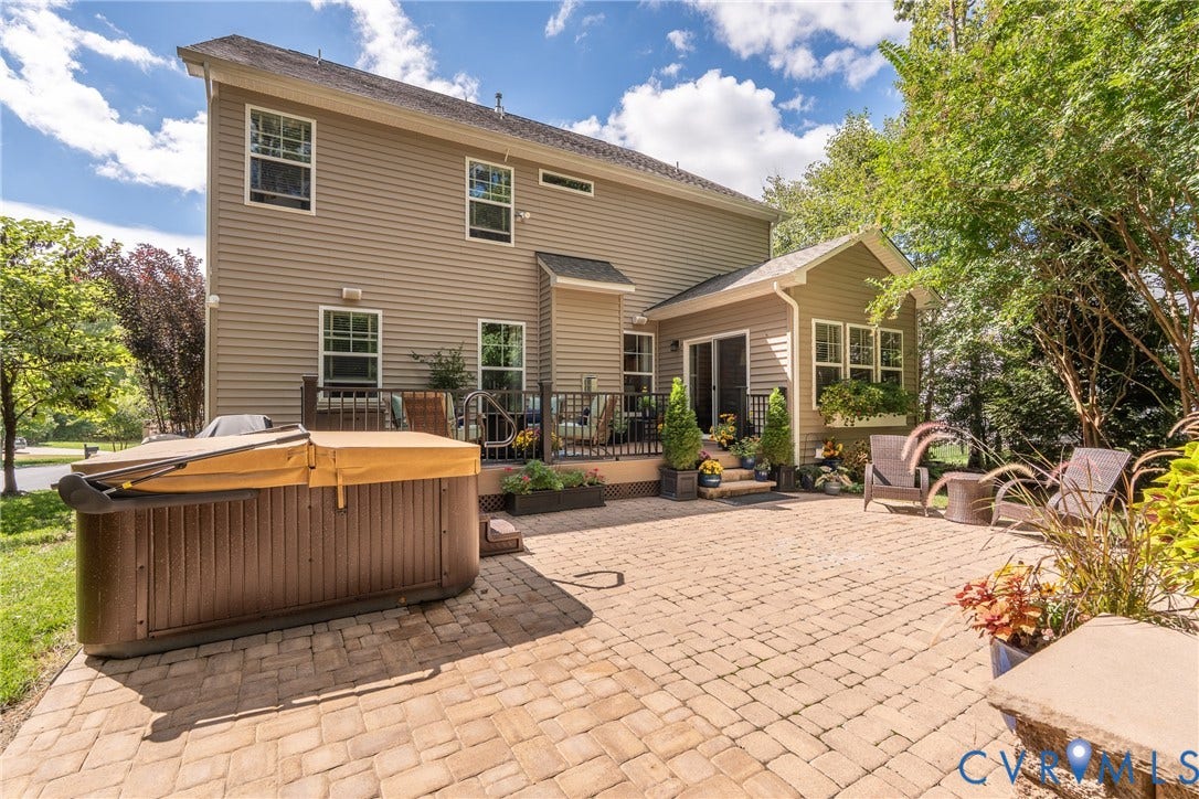 15412 Greenley Place, Hartridge At Harper's Mill, Chesterfield, VA 23832 The backyard includes a natural gas connection for the fire pit, adding convenience to outdoor gatherings.