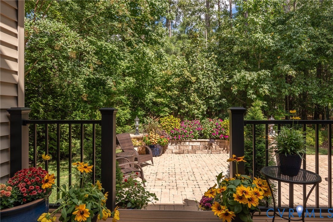 15412 Greenley Place, Hartridge At Harper's Mill, Chesterfield, VA 23832 Thoughtfully positioned above the patio, the deck adds another distinct space for enjoying the backyard.