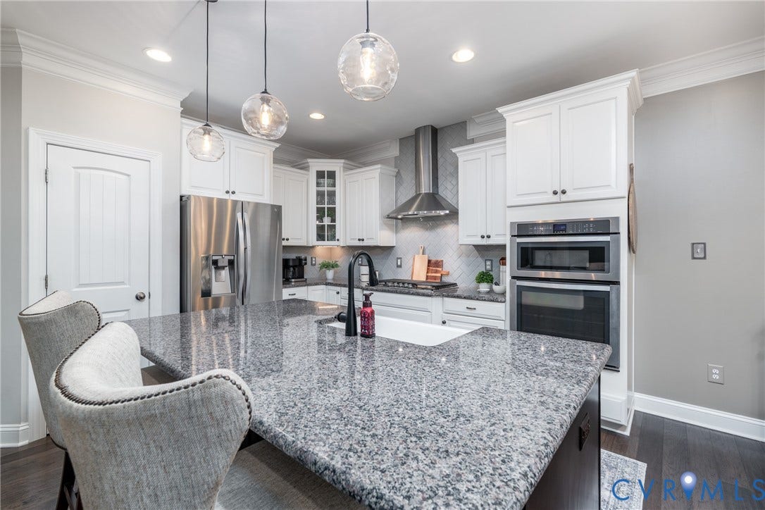 15412 Greenley Place, Hartridge At Harper's Mill, Chesterfield, VA 23832 Beautiful cabinetry offers generous storage while contributing to the kitchen's cohesive design.