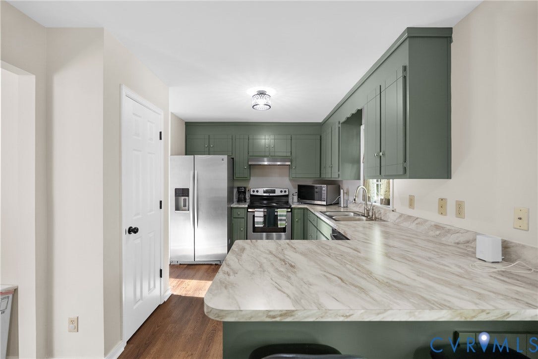 11512 Wiltstaff Drive, Midlothian, VA 23112 Kitchen featuring sage green cabinetry, stone-patterned laminate countertops, stainless steel appliances, wood-finish flooring, and a flush-mount ceiling light