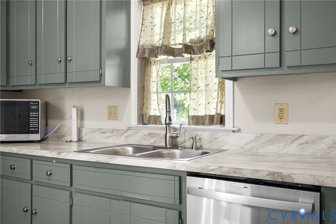 11512 Wiltstaff Drive, Midlothian, VA 23112 Kitchen featuring sage green paneled cabinetry, light-toned stone-patterned laminate countertops, dual-basin stainless steel sink, gooseneck faucet, and stainless steel dishwasher