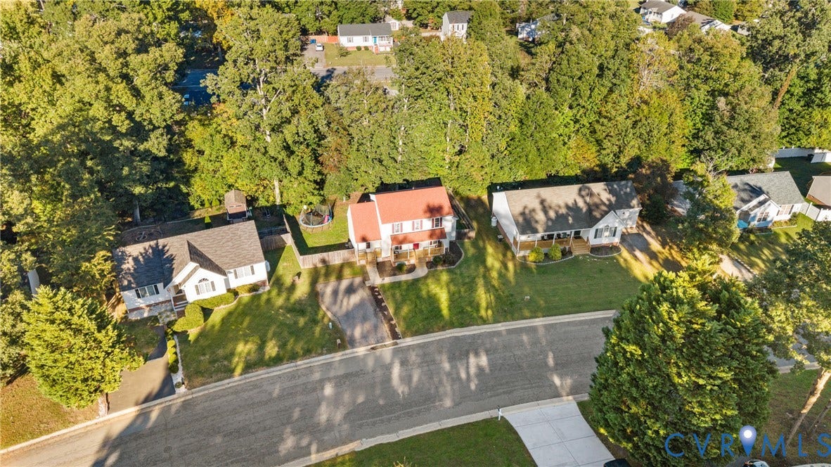 11512 Wiltstaff Drive, Midlothian, VA 23112 Aerial perspective of a multi-structure residential neighborhood featuring asphalt paved streets, concrete driveways, dense mature tree coverage, and managed lawns