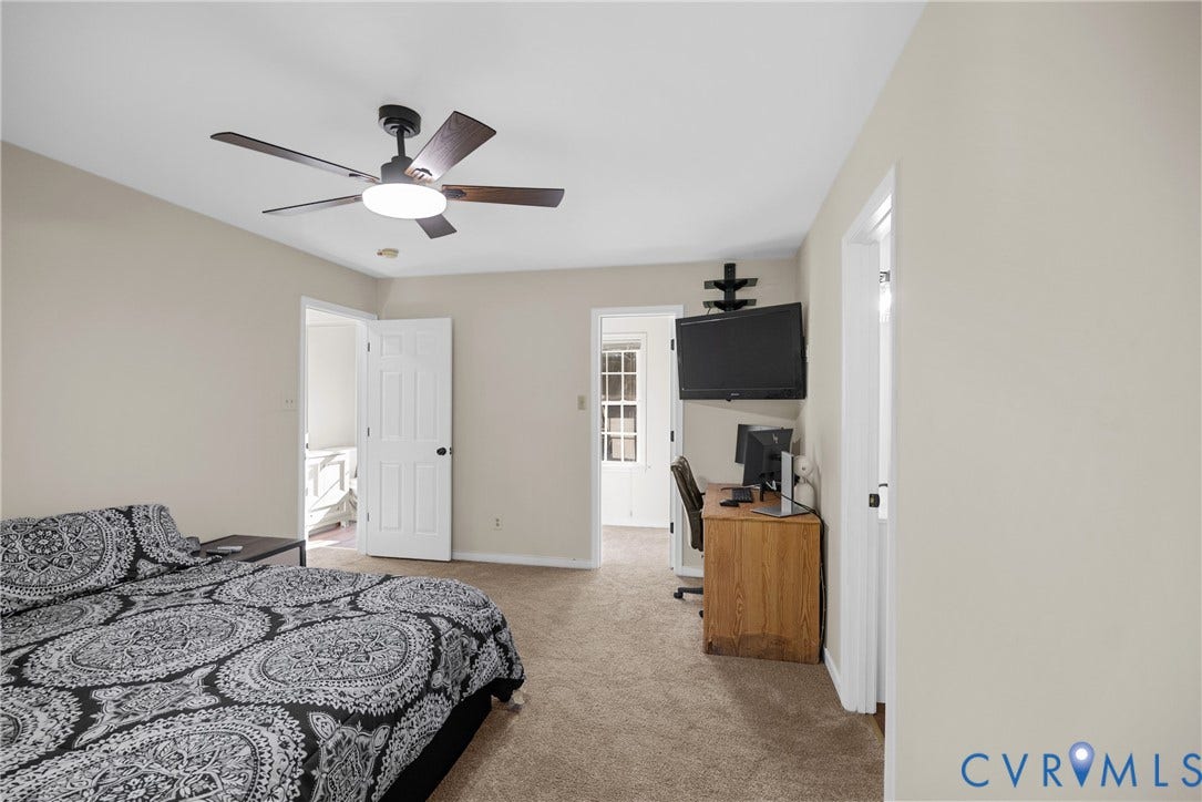 11512 Wiltstaff Drive, Midlothian, VA 23112 Neutral interior space featuring carpeting, ceiling fan with integrated lighting, multi-panel doors, and wall-mounted shelving