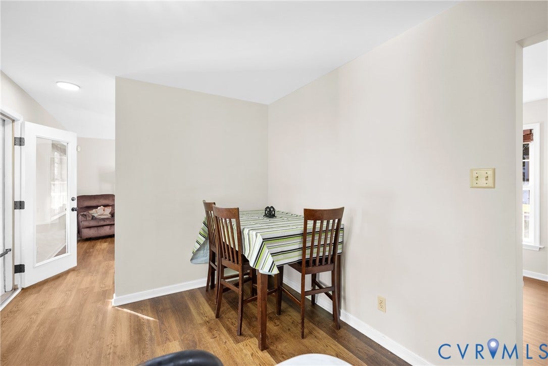 11512 Wiltstaff Drive, Midlothian, VA 23112 Neutral-toned interior walls featuring wood-finish flooring and a glass-paneled entry door