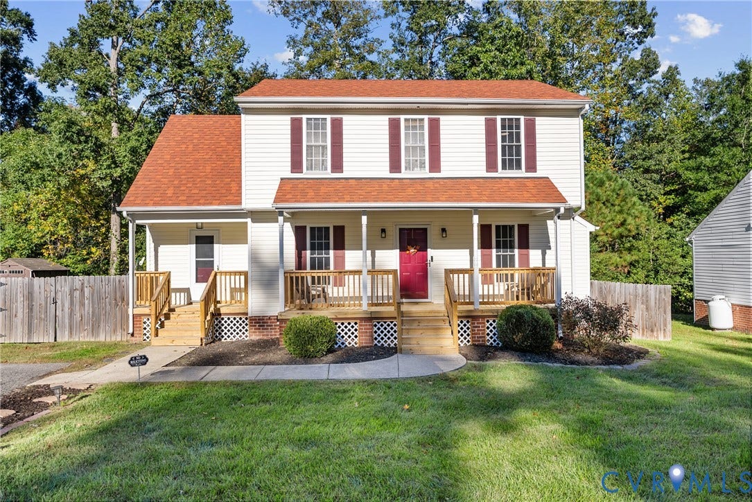 11512 Wiltstaff Drive, Midlothian, VA 23112 Two-story home with light-colored siding, contrasting shutters, a front porch with wood railings, lattice skirting, and a concrete walkway