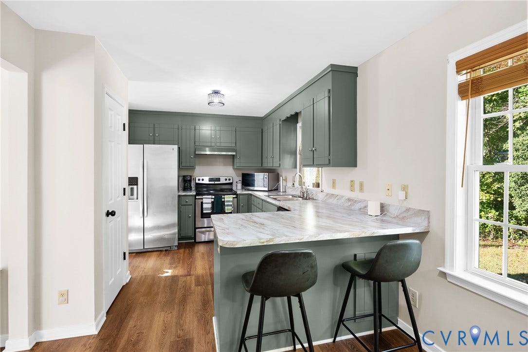 11512 Wiltstaff Drive, Midlothian, VA 23112 Kitchen featuring sage green cabinetry, stone-patterned countertops, stainless steel appliances, and wood-finish flooring