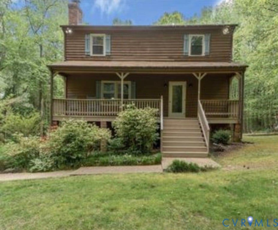 13354 Greenwood Road, Hanover, VA 23059 Two-story wood siding exterior with a covered porch, wood railing, and exterior staircase