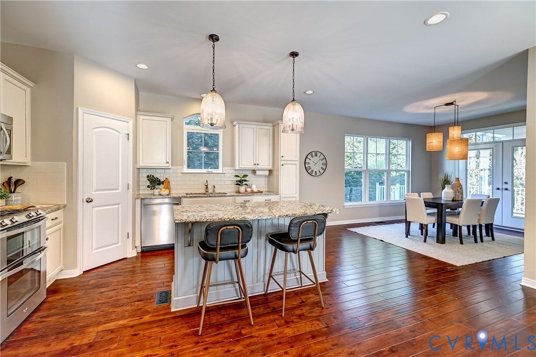 14800 Diamond Creek Terrace, Midlothian, VA 23113 Wood flooring throughout kitchen as well! Granite countertops, soft close, white cabinetry, recessed lighting, and the island is 6" wonderful for entertaining or a quick bowl of cereal before running out